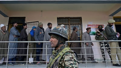A soldier stands guard at a polling station in the Ganderbal district of north-east of Srinagar, Kashmir. AFP