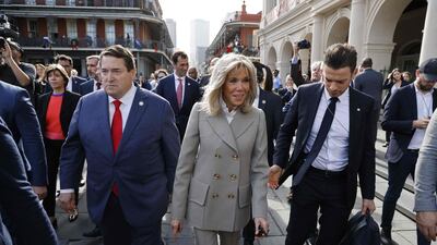 Ms Macron joined her husband for a portion of the walk. AFP