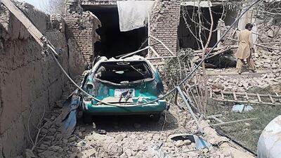 A man inspects damaged houses near the site where a suicide bomber detonated an explosives in a truck, in Balkh district of Balkh province. AFP
