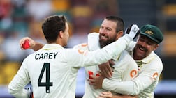 Cricket - The Ashes - Australia v England - Second Test - The Gabba, Brisbane, Australia - December 7, 2025 Australia's Michael Neser celebrates a five-wicket haul after taking the wicket of England's Brydon Carse, caught by Steve Smith REUTERS / Hollie Adams TPX IMAGES OF THE DAY