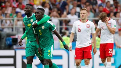 Idrissa Gueye, second left, created Senegal's first goal when his shot was deflected in during the 2-1 win over Poland. Felipe Trueba / EPA