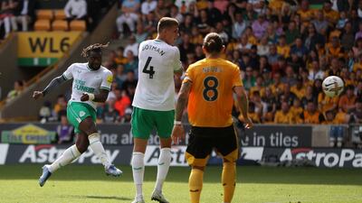 Newcastle attacker Allan Saint-Maximin volleys home to make it 1-1 in the Premier League match at Molineux. Reuters