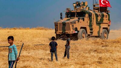 A Turkish military vehicle on the outskirts of Tal Abyad on the border with Turkey on October 4, 2019. AFP