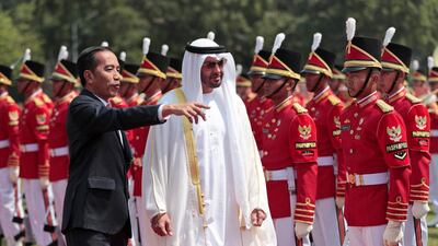 Sheikh Mohamed and Mr Widodo inspect the guard of honour. Dita Alangkara / EPA