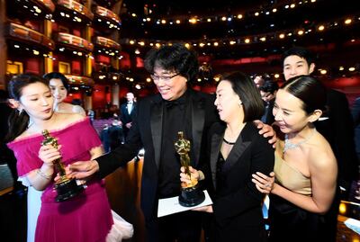 Best Picture Award winners for 'Parasite' celebrate on stage