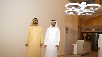 Sheikh Mohammed bin Rashid, prime minister of the UAE and Ruler of Dubai, left, and Sheikh Hamdan bin Mohammed, the Crown Prince of Dubai personally attend testing of a UAV prototype designed to carry parcels. Wam