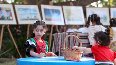 Ajwaan Mansour, 6, wearing her National Day dress in the Kids' Zone at the Heritage Village in Abu Dhabi. Khushnum Bhandari / The National