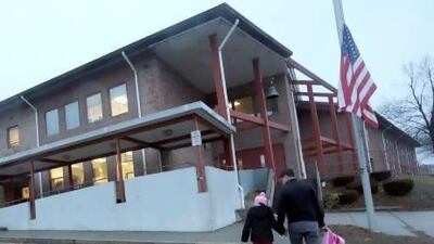 Manuel Moreno, right, walks his daughter Jady, 6, to the Morris Street elementary school in Danbury, Connecticut. Parents and teachers have tried to quell children’s fears about returning to school since the Newtown killings.