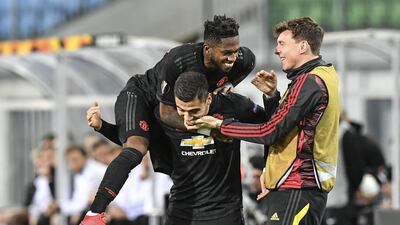 Manchester United's Fred jumps on scorer Andreas Pereira after the fifth. AP