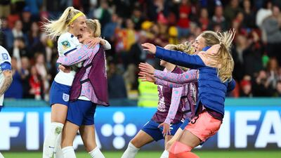England's Chloe Kelly, left, celebrates after scoring the winning penalty. AP