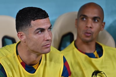 Cristiano Ronaldo sits on the substitutes bench after being dropped for the match against Switzerland. EPA