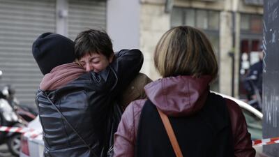 Mourners gather outside of the Carillon bar in the 10th district of Paris. Le Petit Cambodge, adjacent to the Carillon bar, was the scene of one of the attacks overnight. Kenzo Tribouillard/AFP Photo