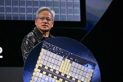 Nvidia chief executive Jensen Huang holds a Grace Blackwell NVLink72 as he makes a keynote address at the Consumer Electronics Show in Las Vegas, Nevada, on January 6, 2025. AFP