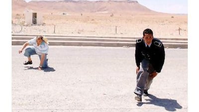 Customs officers run during bombings on the Tunisian side of the border crossing of Dehiba. Anis Mili / Reuters
