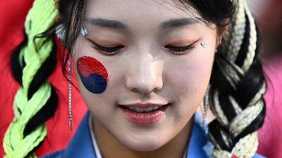 A South Korea fan ahead of her country's Group H game against Uruguay at the Education City Stadium in Al Rayyan, north-west of Doha. AFP