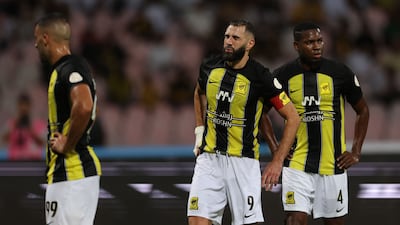 Karim Benzema appears to wince in pain shortly before being substituted during Al Ittihad's Saudi Pro League match against Al Wehda. AFP