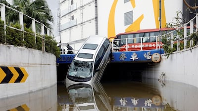 A vehicle damaged by Typhoon Hato is seen in Macau, China. Tyrone Siu / Reuters