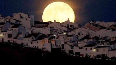 The Supermoon rises over houses in Olvera, in the southern Spanish province of Cadiz, July 12, 2014. Occurring when a full moon or new moon coincides with the closest approach the moon makes to the Earth, the Supermoon results in a larger-than-usual appearance of the lunar disk. Jon Nazca / Reuters