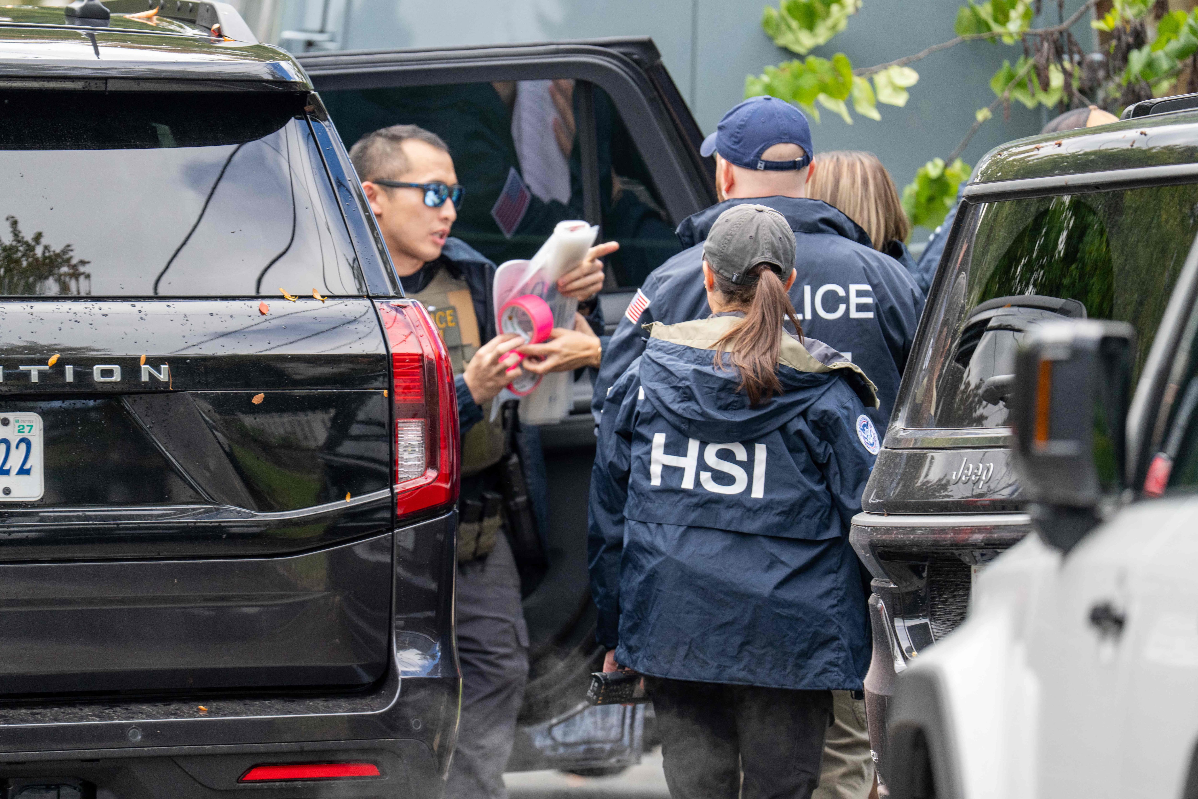 Homeland Security Investigations officers remove documents from the Washington home of US Democratic Representative Ilhan Omar on October 12. AFP