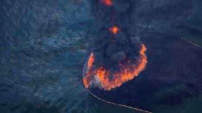 Flames and smoke rose from a controlled burn of oil on the surface of the Gulf of Mexico near BP's Deepwater Horizon spill yesterday.