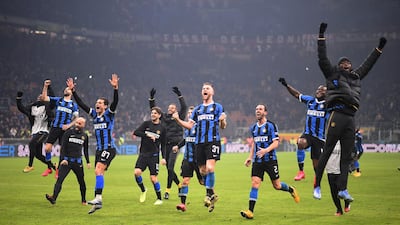 Inter players celebrate after their derby win over AC Milan in Serie A on Sunday, February 9. Reuters