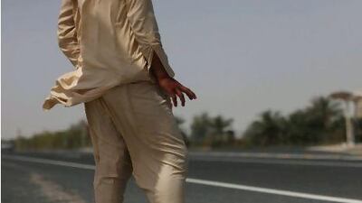 Mohammed Rizwan, 20, originally of Fasial Abad, Pakistan, waits two hours to get a ride from the nearest mosque for kilometers back to his accommodation at the Barari Forest, where he is a gardener. He hitches every Friday to pray.