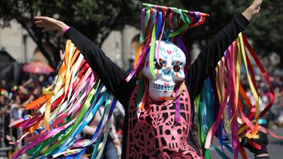 People participate in the main avenues in a parade to commemorate Day of the Dead in Mexico City. EPA