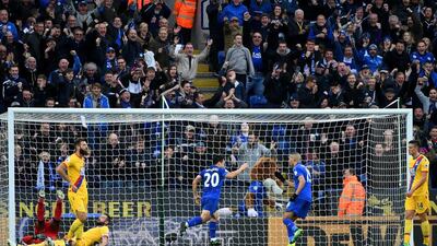 Shinji Okazaki of Leicester City, centre, begins to celebrate scoring his side’s second goal. Ross Kinnaird / Getty Images
