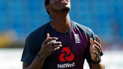 England's Jofra Archer balances a ball on his head. Reuters