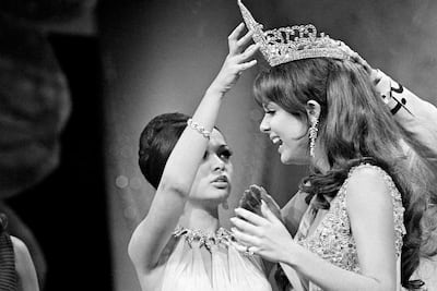 Marison Malaret, right, of Puerto Nuevo, Puerto Rico, receives the Miss Universe crown from previous year's title holder, Gloria Diaz of the Phippines during ceremonies April 11, 1970 on Miami Beach. AP