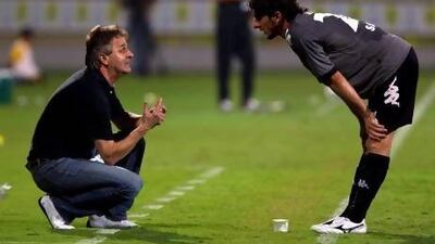 Dubai, United Arab Emirates, October 28, 2012: Al Dhafra's head coach Dzemal Hadziabdic, left, speaks with Saif Mohamed during the seond half of their Pro League match against Al Wasl at Zabeel Stadium in Dubai on October 28, 2012. Christopher Pike / The National