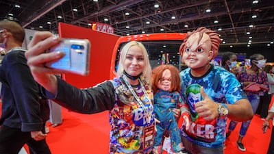 A fan takes a selfie with The Chuckies.