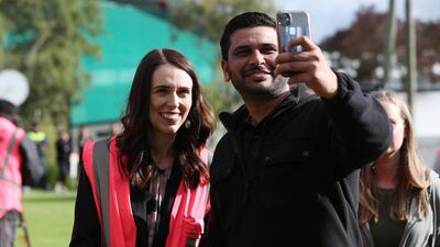 Prime Minister Jacinda Ardern (L) has a selfie taken as she meets and talks to staff during the visit to Trevelyans Kiwifruit and Avocado Packhouse in Tauranga, New Zealand. Getty Images