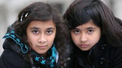 Sara Qurashi, 13, left, and her cousin Saamiya Qurashi, 9, outside the UAE Embassy in London where her family are staging a protest on behalf of Sara's father, who is serving a seven-year prison sentence.