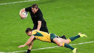 Dane Coles of the All Blacks beats the tackle of Nic White of the Wallabies to score a try during the Bledisloe Cup match on Saturday at Eden Park in Auckland. Hagen Hopkins / Getty Images / August 15, 2015