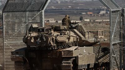 An Israeli tank enters the buffer zone between Israel and Syria, near Quneitra, in the Israeli-annexed Golan Heights. EPA