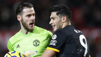 Wolves' Raul Jimenez, right, attempts to retrieve the ball from Manchester United goalkeeper David de Gea. EPA