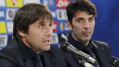 Italy's coach Antonio Conte, left, and goalkeeper Gianluigi Buffon attend a news conference ahead of their international friendly against Spain. REUTERS/Alessandro Garofalo