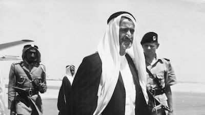 Sheikh Rashid bin Saeed Al Maktoum with the chief of police, Jack Briggs, behind him at Dubai Airport, in 1960. Keystone Features / Hulton Archive / Getty Images