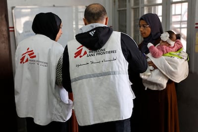 A Palestinian woman and child at a Doctors Without Borders clinic in Gaza city's Al Rimal district. AFP