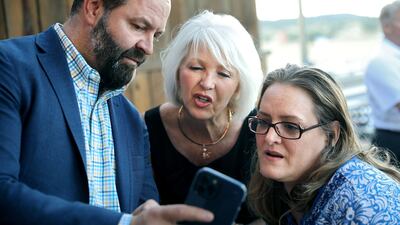 Mesa County Clerk and Colorado Republican candidate for secretary of state Tina Peters, centre, follows election results with supporters. AFP