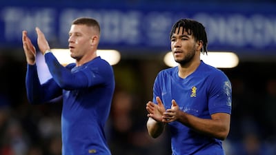 Reece James and Ross Barkley applaud the fans after the match. Reuters