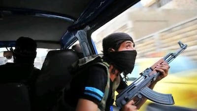 Syrian rebels hunt for snipers after attacking the municipality building in the city centre of Selehattin, near Aleppo. They ‘liberated’ several districts of Aleppo yesterday, a Free Syrian Army spokesman said.