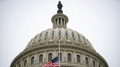 The American flag flies at half staff at the US Capitol Building on the fifth day of the impeachment trial of former President Donald Trump, on charges of inciting the deadly attack on the US Capitol, in Washington, February 13. Reuters