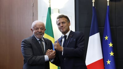 French President Emmanuel Macron, right, with Brazilian President Luiz Inacio Lula da Silva. EPA