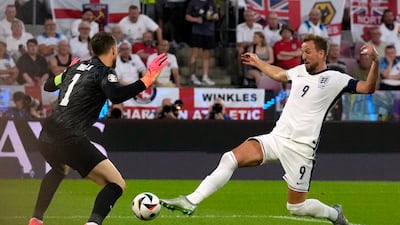 England's Harry Kane just fails to reach get a touch on a cross from Kieran Trippier as Slovenia's goalkeeper Jan Oblak looks on. AP
