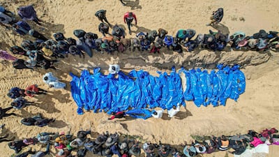 Bodies of Palestinians released by Israel are prepared for a mass funeral in Rafah in the southern Gaza Strip in March. AFP