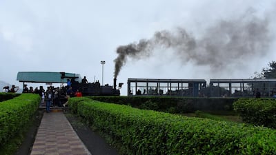 A Darjeeling Himalayan Railway steam train prepares to leave Batasia Loop.