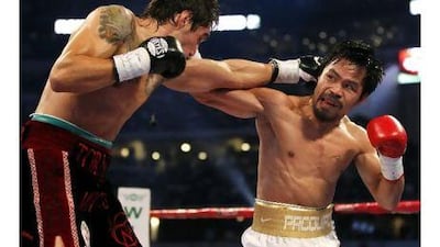 Manny Pacquiao and Antonio Margarito trade punches on the way to Manny's easy victory in 2010. MIKE STONE / REUTERS