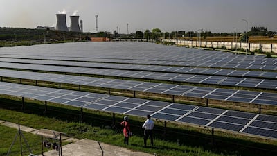 Solar panels are seen at the National Thermal Power Corporation plant, which is primarily coal-fired, in Dadri. India needs to increase its renewable power capacity to produce green hydrogen. AFP